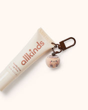 Load image into Gallery viewer, Cinnamon Scroll Flocked Charm
